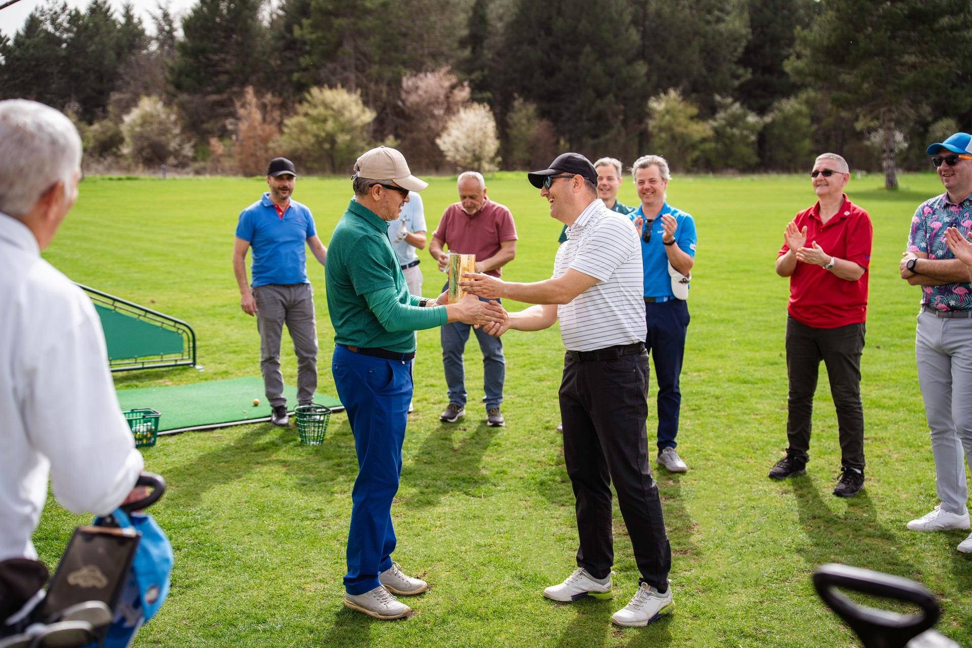 Golfer receiving a trophy