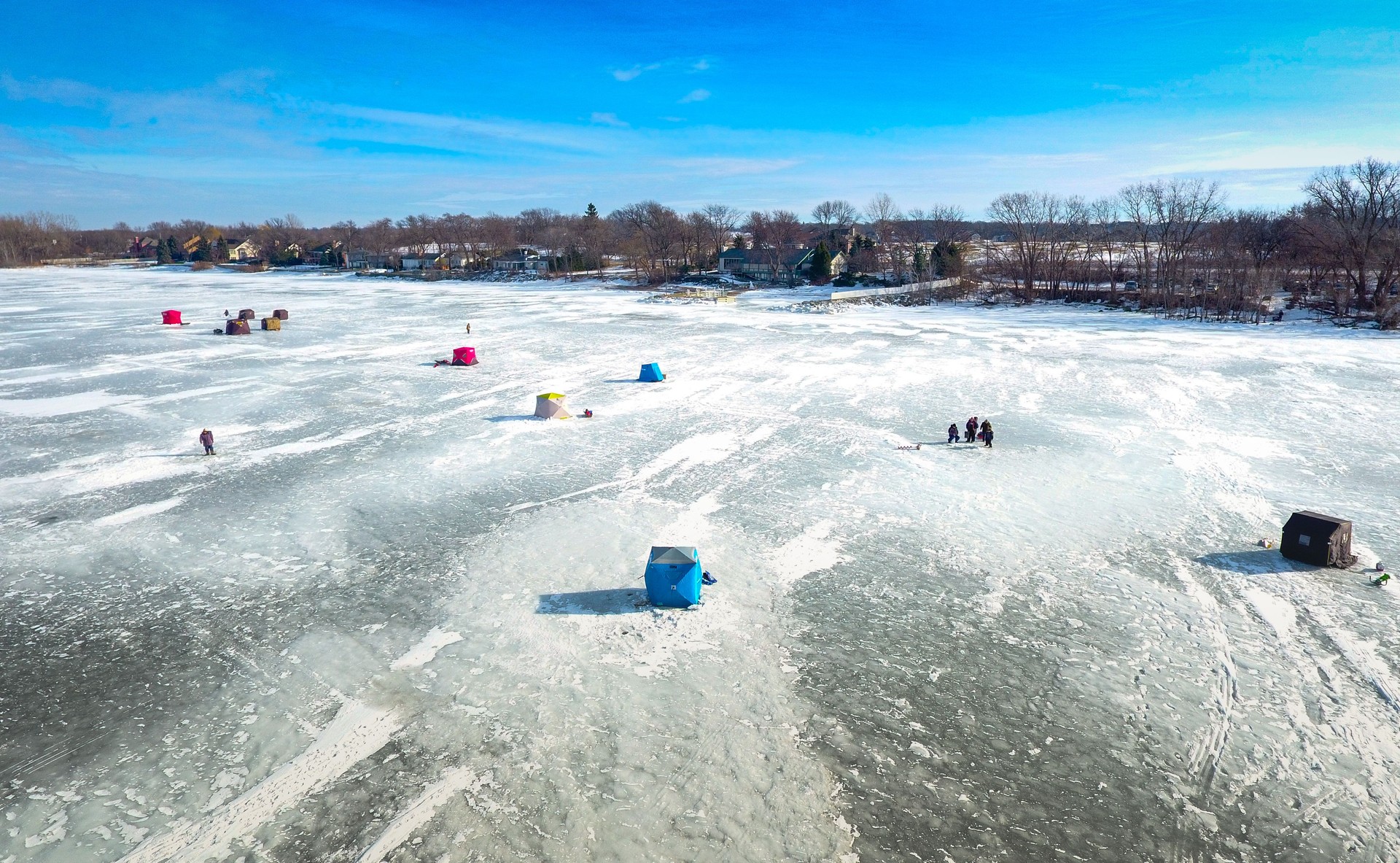 Ice fishing on a warm winter day